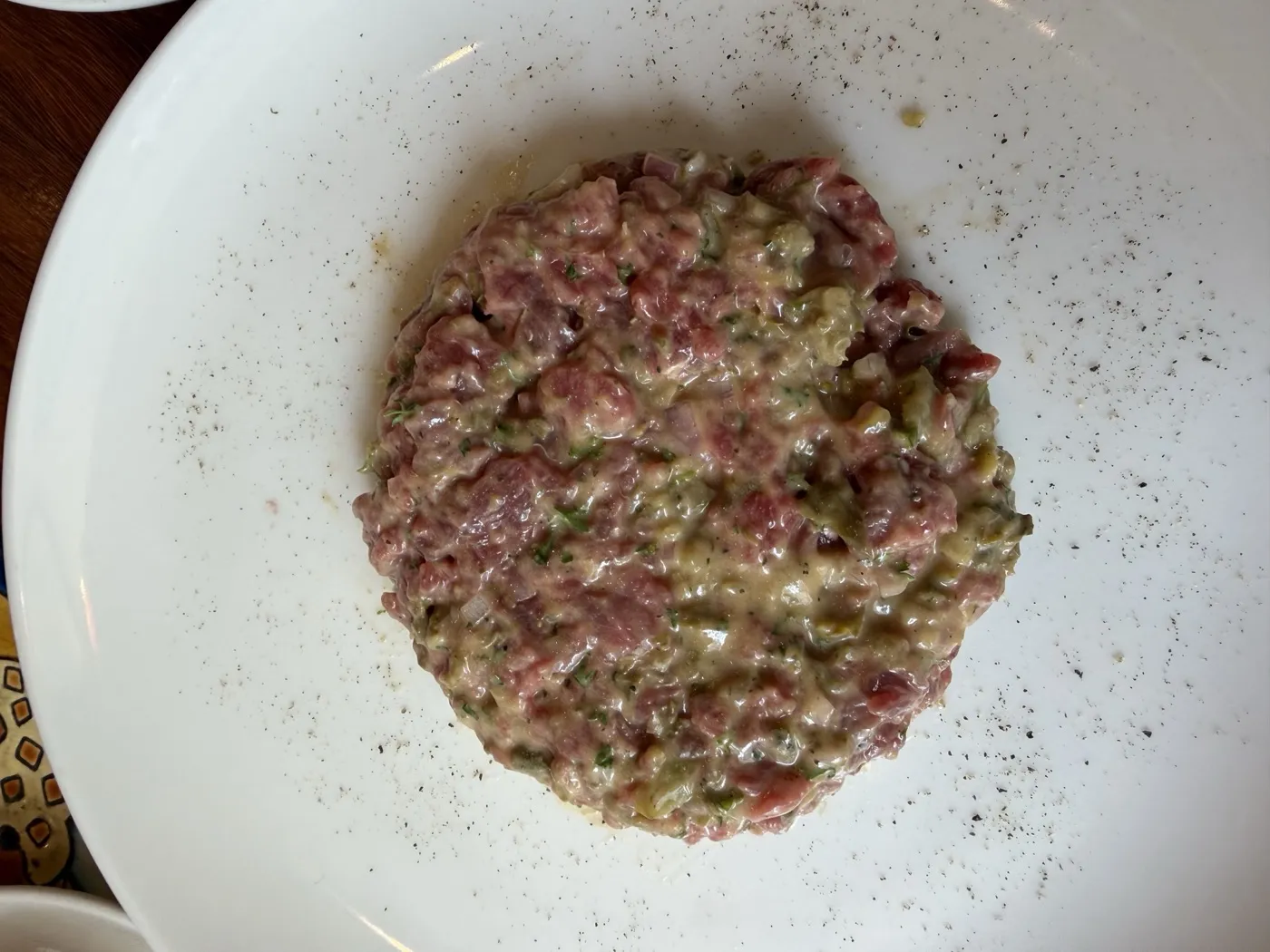 Hand-cut steak tartare with capers, onion and herbs